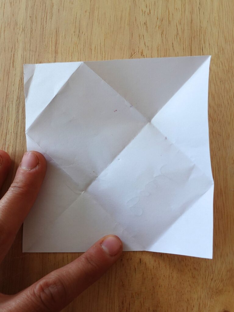 square piece of paper with fold lines in it