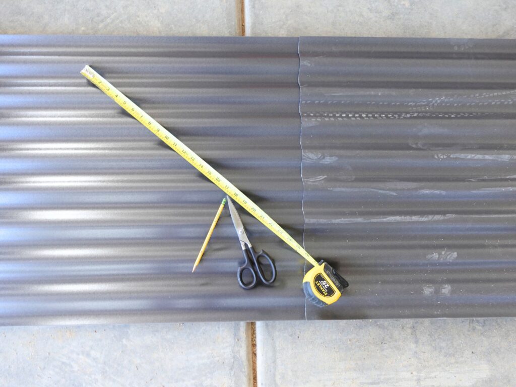 roofing materials for rabbit hutch, measuring tape, scissors, pencil